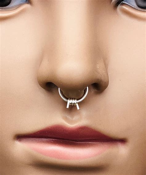 Faux septum ring. The most common types of septum rings are curved barbells (horseshoe septum piercing), septum clickers, captive bead rings, and plain rings. You can also go with a fake septum piercing if you want to avoid the pain and risks of nose piercings. 1. Curved Barbells. Titanium nose ring curved barbell horseshoe 5 pcs $29.9, SHOP NOW. 