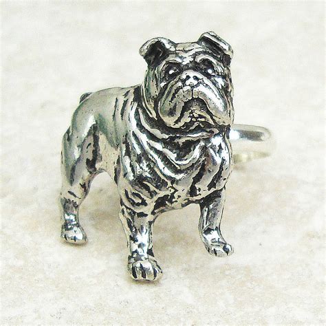 Featuring an adorable bulldog puppy design, crafted in pewter tone metal and pave set with black and shampagne crystals