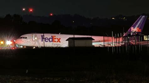 FedEx jet skids off the runway at a Tennessee airport after landing gear failure