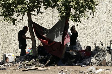 Federal judge says California’s capital city can’t clear homeless camps during extreme heat