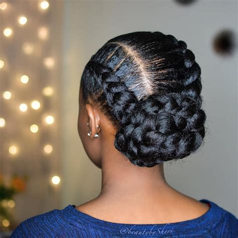 Blue Cornrow Top Bun. @cutelooksdar / Instagram. An updo is a sophisticated hairstyle that pairs fantastically with cornrows. Most might opt for a low-placed bun, but if you really want to stand out, braid your hair into an elaborate topknot. The style looks extra stunning in bold shades of blue . 13 of 40.. 