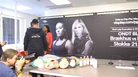 Female boxer kisses opponent on the lips during face-off