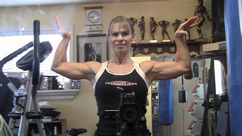 Watch FBB Julie Bourassa show off her impressive pecs and arms in this video. She is a Canadian female bodybuilder who has won several titles and awards. You will be amazed by her strength and .... 