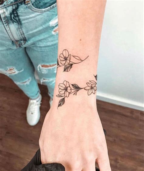 Wrist tattoos for women are usually done in one of three ways: wrapped around, under, or inside the wrist. These tattoo ideas tend to be smaller and more delicate than larger ones, but they can still make a statement when done right.. 