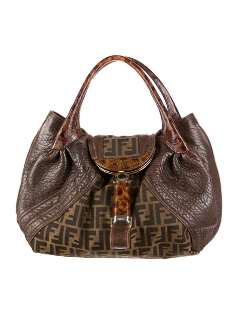 Fendi spy bag. Brown leather Fendi Spy bag with gold-tone hardware, dual signature braided leather shoulder straps, brown Zucca canvas lining, single pocket at interior flap with kiss-lock closure and flap at top. Shop authentic designer handbags by Fendi at … 