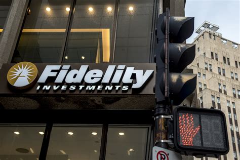 A sign marks a Fidelity Investments office in Boston, Massachusetts, on April 28, 2022. Fidelity Investments is launching a commission-free crypto trading product for retail investors. The firm ...