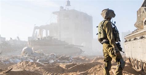 Fighting in southern Gaza city after Israel says it is pulling thousands of troops from other areas