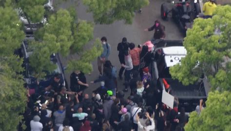 Fights break out outside school district meeting as protesters battle over gender studies