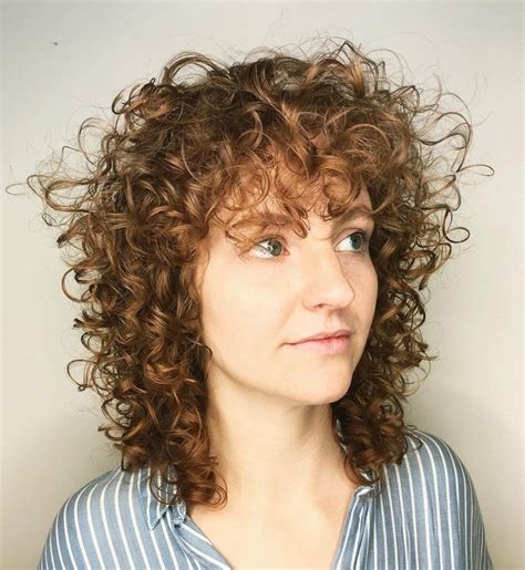 Fine curly hair. The messiness of the hairstyle creates both volume and interest making it a great choice for women with medium to long hair. 4. Layered Bob for Fine Thin Hair. instagram/stacy.m.hair_. As a hairstyle for women over 50 with thin hair, a layered bob gives the appearance of added weight and volume to your look. 