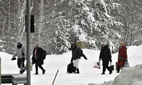 Finland reports a rush of migrant crossings hours before the reclosure of 2 border posts with Russia