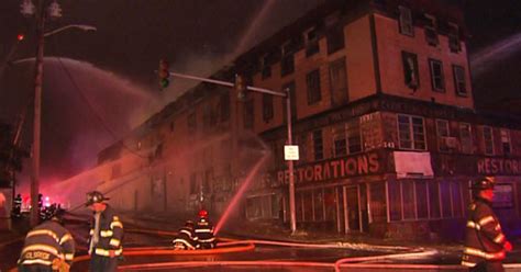 Fire crews battle Brockton blaze that spread through 2 multi-family homes