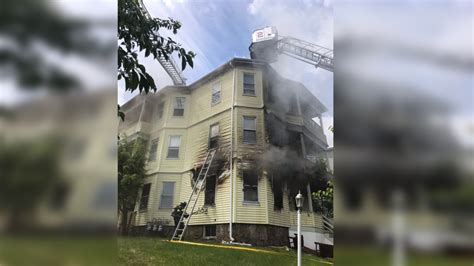 Fire crews battle large Brockton blaze that spread through 2 multi-family homes