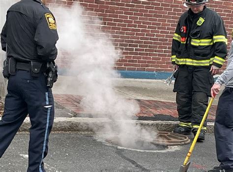 Fire crews respond to smoking manhole in Brookline