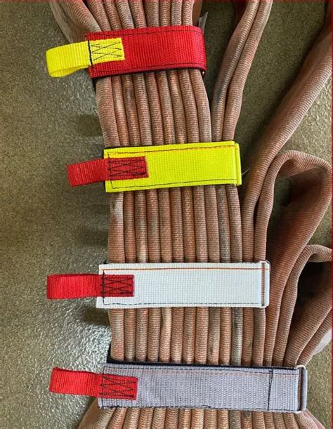 Fire hose bundle straps.  The strap utilizes heavy duty Velcro and a rectangle met...