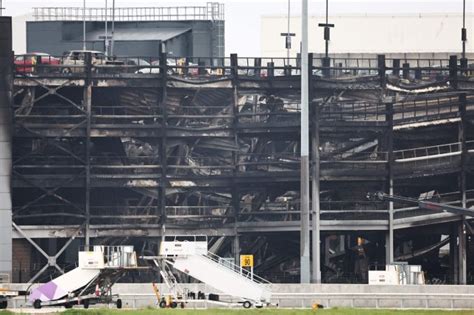 Fire partially collapses a parking structure at London’s Luton Airport and 5 people hospitalized