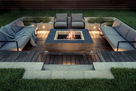 Fire pit area. Fire pits for backyards is a popular backyard feature that brings warmth and ambiance for gatherings with family and friends. But determining the right size for your fire pit area takes careful planning and consideration. The ideal fire pit size depends on the type of fire pit, number of people, available space, and safety clearance required. A … 