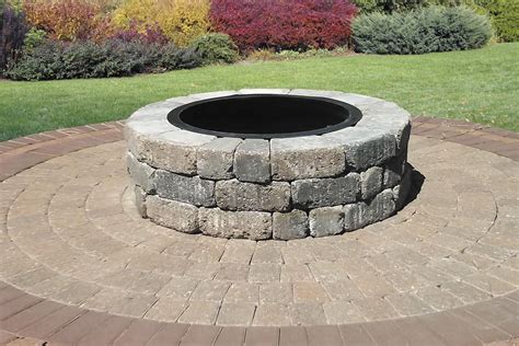 A fire pit can extend your patio season and add a warm ambiance to your outdoor space. The design of the Springdale fire pit catches the eye by adding a layer of dimension and color. This fire pit is constructed from Belgian blocks, which create a durable yet attractive structure for your backyard. The Belgian blocks are available in a variety of different colors, and no cutting is required .... 