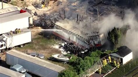 Fire sparks at SW Miami-Dade plant nursery, spreads to tractor-trailer; no injuries