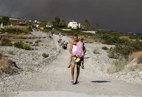Fire still blazing on the Greek island of Rhodes as dozens more erupt across the country.