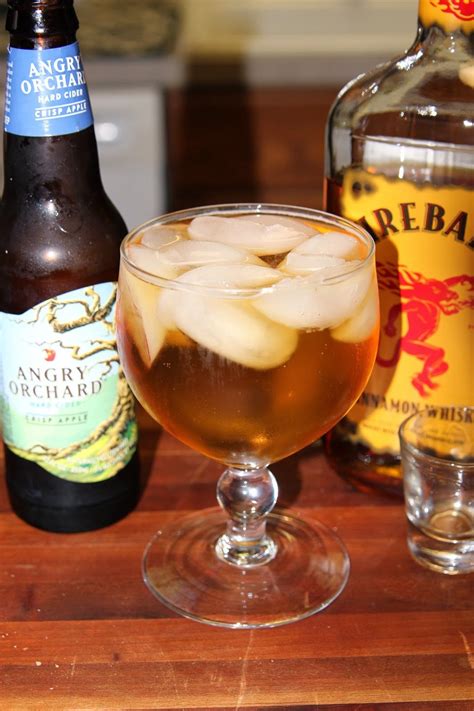 Fireball and apple cider. Garnish each mug with an apple slice and cinnamon stick. For a little something extra: Mix 2 tablespoons of granulated sugar and 1 teaspoon of cinnamon together on a plate. Dampen the rims of each mug with a wet paper towel, then dip the rims into the cinnamon sugar mixture for a sweet rim. 