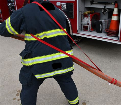 Firefighter webbing loop.  Two "handles" are made by bringing the webbing underneath the...
