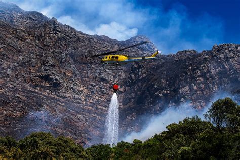 Firefighters are battling a wildfire on the slopes of a mountain near Cape Town in South Africa