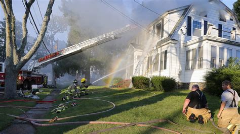 Firefighters battle large fire in multi-family home in New Bedford