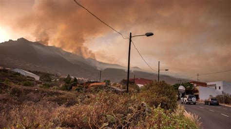 Firefighters battle smoke and heat to control a major wildfire in Spain’s tourist island of Tenerife