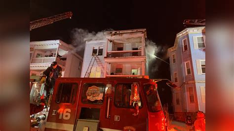 Firefighters battling multi-alarm blaze in East Boston triple-decker
