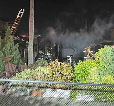 Firefighters contain outbuilding fire at marina