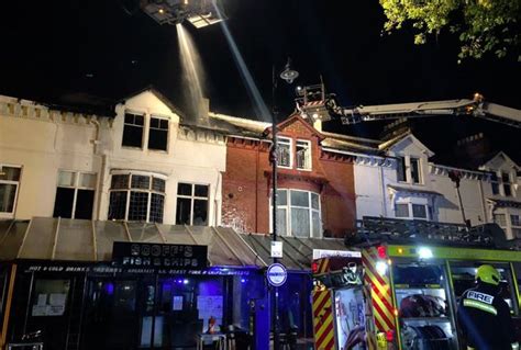 Firefighters remain at scene of massive chip shop blaze