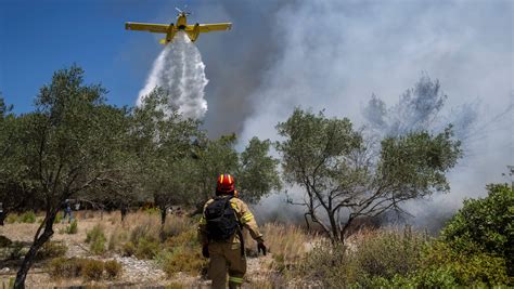 Firefighting plane crashes in Greece as blazes rage out of control and new evacuations are ordered