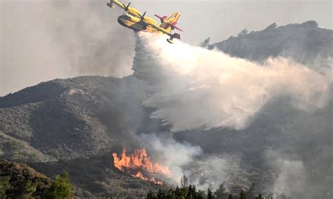 Firefighting plane crashes in Greece as wildfires rage