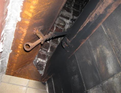 Fireplace damper chain replacement.  The fireplace damper clamp attaches to the damper...