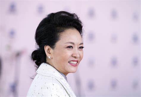 First Lady Peng Liyuan attends a concert in her honour