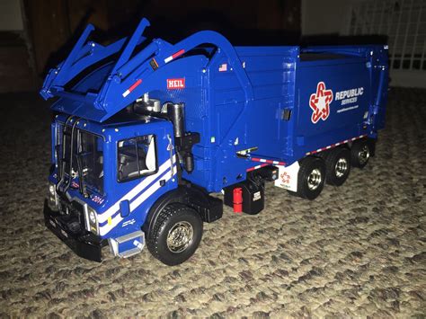 Solomon got to play tonight with his favorite garbage truck toys. He really loves Legos and so he bought a front loader Lego garbage truck. He also loves pla... . 