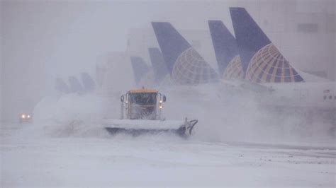 First wind, now snow and ice near Denver airport causes hundreds of flights to be diverted, delayed