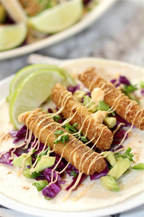 Fish stick tacos. In a large resealable plastic bag, combine the lemon juice, oil and garlic. Add the halibut; seal bag and turn to coat. Refrigerate for 30 minutes. For sauce and salsa, peel and cube avocados. In a small bowl, mash 1/4 cup avocado. Stir in the remaining sauce ingredients. Place remaining avocados in a small bowl; stir in the remaining salsa ... 
