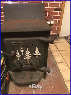 Ol' timey wood burning cast-iron stove with 3 eyes. Vill