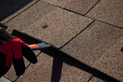 Fixing roof shingles. A new asphalt shingle roof costs $4.50 to $9.00 per square foot with the average range between $5.00 and $7.50 per square foot. The cost is determined in part by whether you’re simply adding a second layer ($4.00 – $4.65/sq. ft.) or doing a tear-off, removing roofing materials down to the deck ($4.50 – $8.00). 