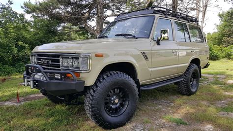 This 1988 Toyota Land Cruiser FJ62 is finished in light blue and dark gray over gray cloth, and it is powered by a 4.0-liter inline-six paired with a four-speed automatic transmission and a dual-range transfer case.. 
