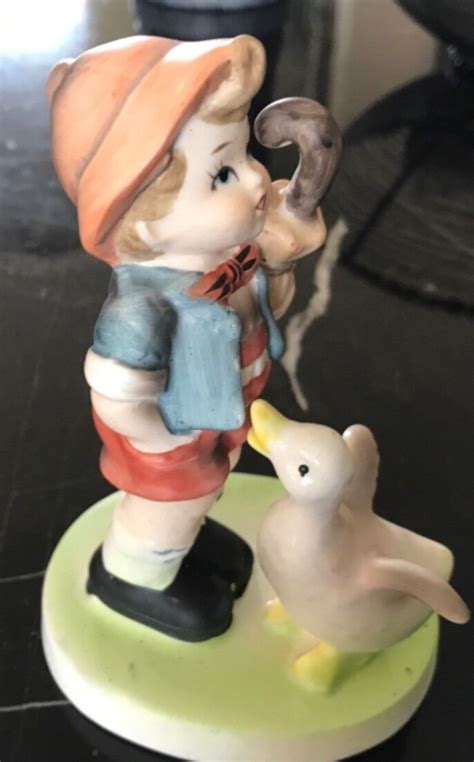 This vintage Flambro Collectors Choice Series figurine features a charming boy holding a lollipop and a duck. The intricate details of this porcelain figurine make it a perfect addition to any collection. The Flambro brand is known for its high-quality collectibles, and this piece is no exception. The multicolor design and Taiwan craftsmanship make it a unique and valuable item.This figurine .... 