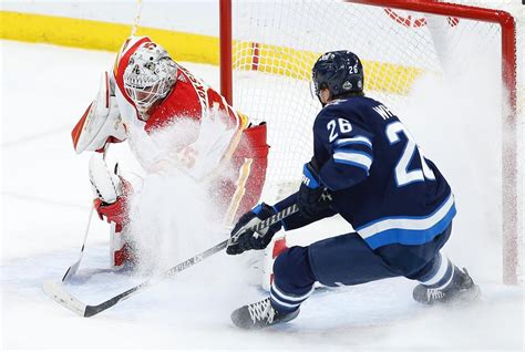 Flames beat Jets 3-1 to keep playoff hopes alive