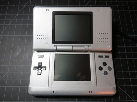 Features overview: 32 Mbit Flash memory. 8kx8 or 32kx8 nvSRAM (depending on parts availability) Aluminum anodized covers. 3D printed carbon fiber frame. Laser etched graphics. USB port for game loading. Uses a current generation GUI called HyperBoyFlasher. Compared to FlashBoy+, HyperBoy has the following advantages: