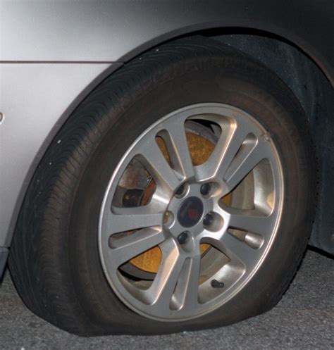 Flat tire at night. Due to various factors, including improper alignment, tires may wear unevenly across the tread pattern. Regular tire rotations at Jiffy Lube® can help evenly distribute wear — so you get the most miles out of your tires while maximizing traction on all four wheels and helping prevent flat tires. Just another way to Leave Worry Behind®. 