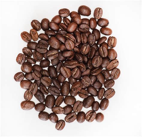 Flavored coffee beans. The most common method is to roast the beans with the flavorings, although some companies also add the flavorings after roasting. The flavored beans are then ground and packaged for sale. The flavored coffee grounds can be used to make flavored coffee drinks or used as a baking ingredient. Common flavorings include chocolate, vanilla, and … 