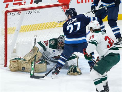 Fleury helps lift Wild into first place in Central