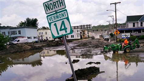 Flooded New England communities shift to recovery, shoveling out tons of mud and debris