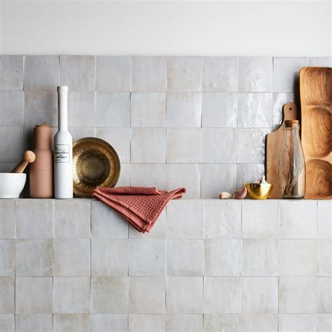 Product Details. For an elevated look to your design, choose the Zellige Perla Polished Ceramic Tile with a polished or high gloss finish. Use this white tile to add new visual interest in any space like the bathroom, kitchen, living room, and more. Ceramic tile is versatile and easy to install.. 