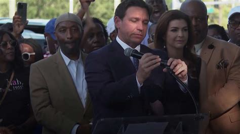 Florida Gov. Ron DeSantis booed at vigil as hundreds mourn victims in Jacksonville store shooting